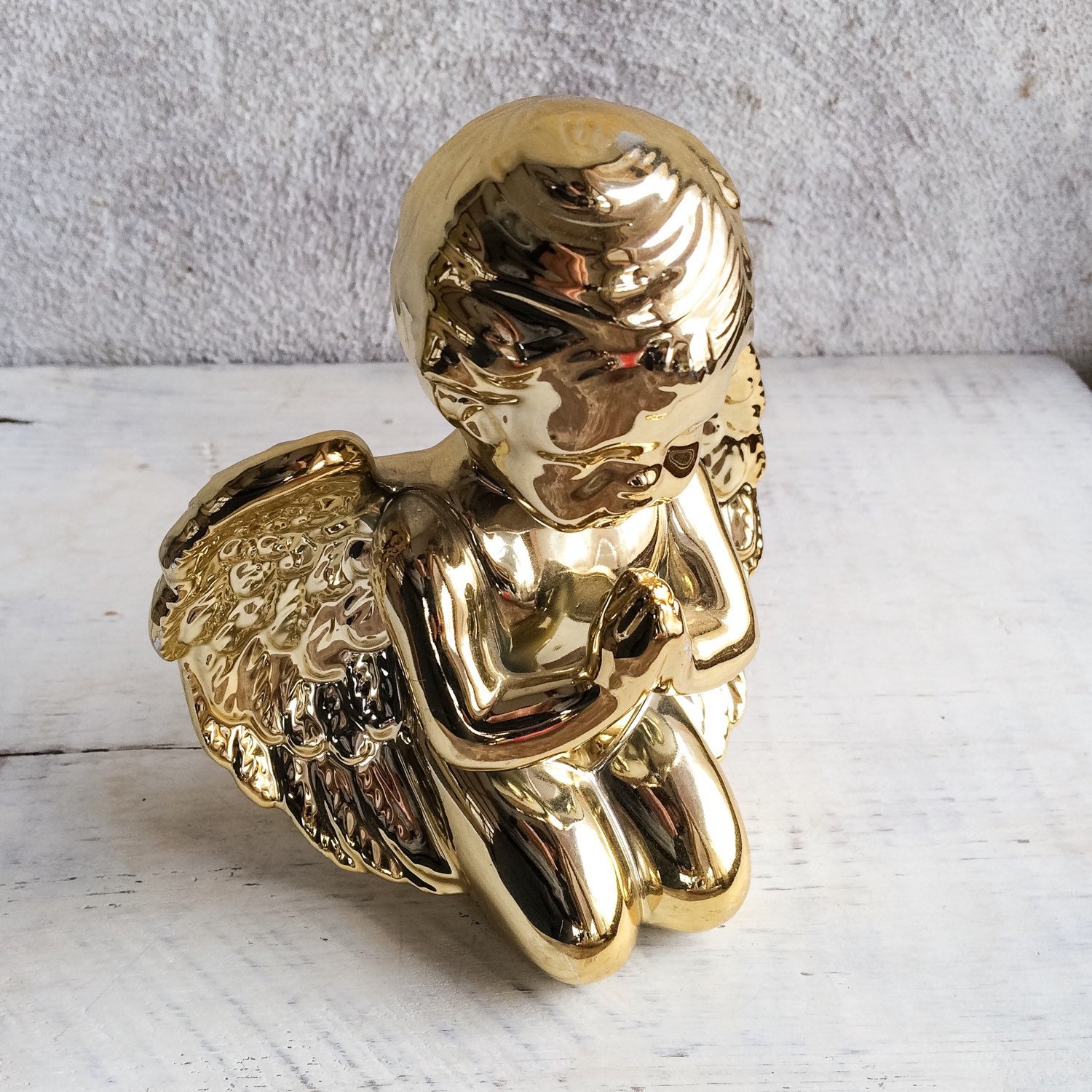 Pair of vintage shiny gold porcelain cherub statues shiny