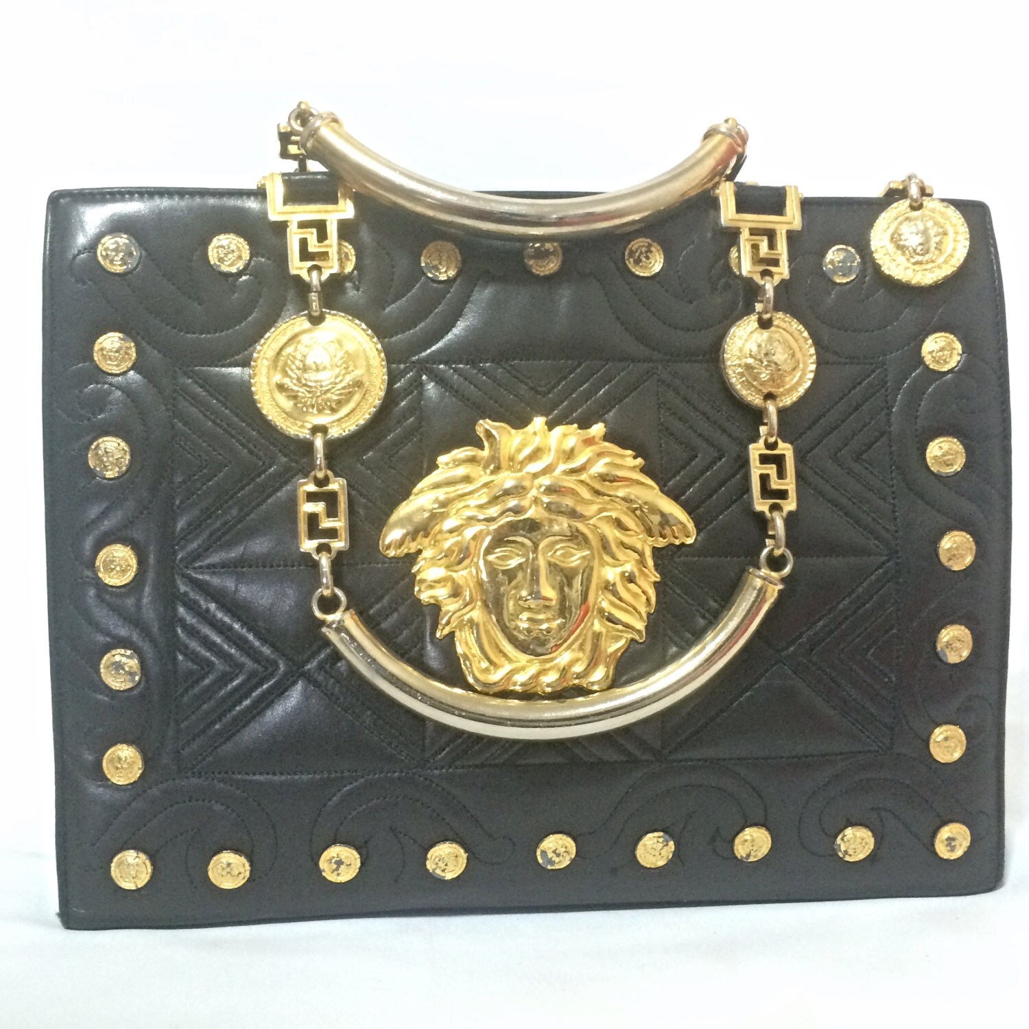 Vintage Gianni Versace black leather tote bag with big golden