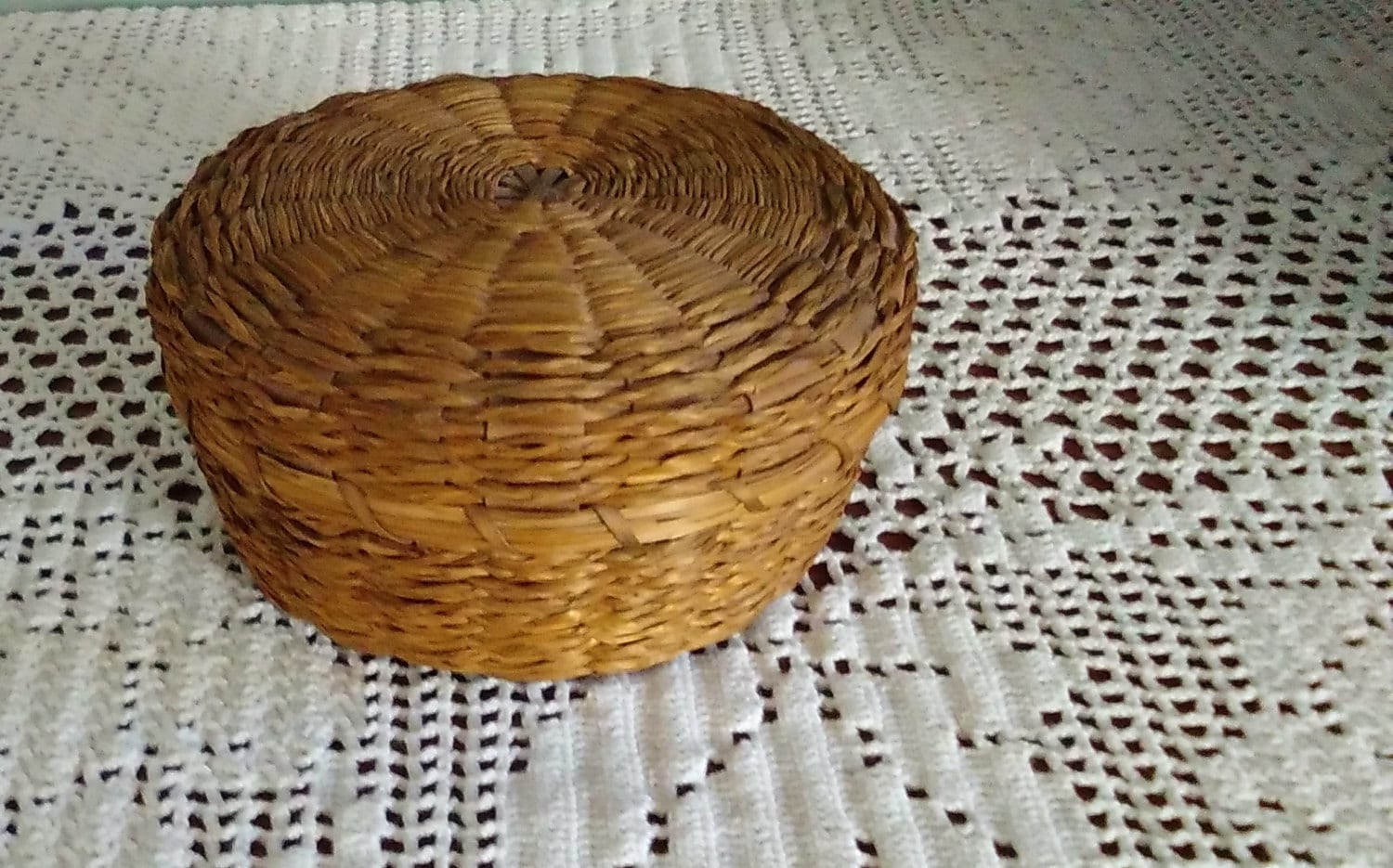 Small round basket with lid hand woven of Native American
