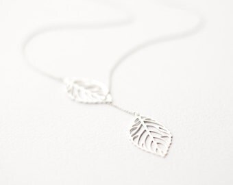 Delicate silver necklace with two leaves