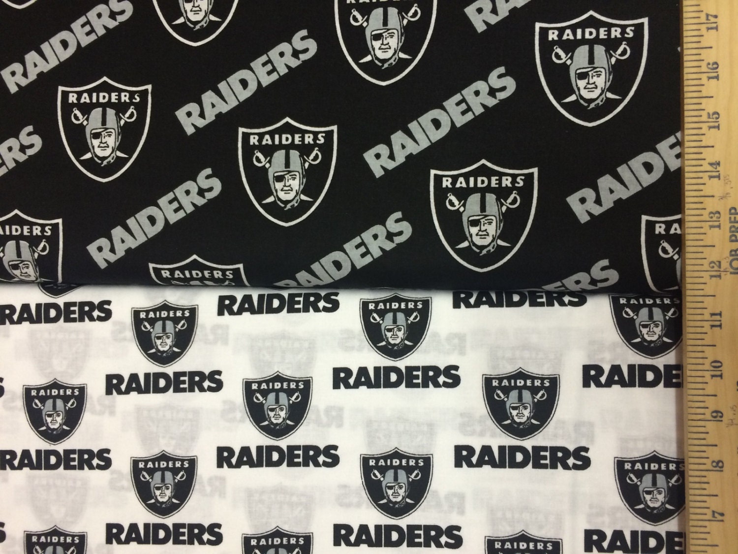 Oakland Raiders White & Black NFL Logo Cotton Fabric by Fabric