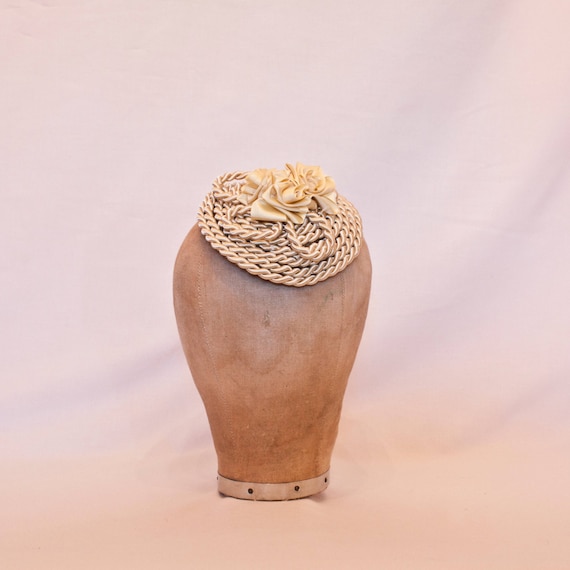 Handmade champagne coloured cord fascinator hat, decorated with handmade ribbon roses
