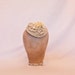 Handmade champagne coloured cord fascinator hat, decorated with handmade ribbon roses