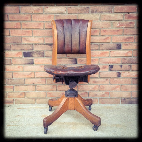 Items similar to Vintage Solid Oak and Leather Gunlocke Banker's Chair