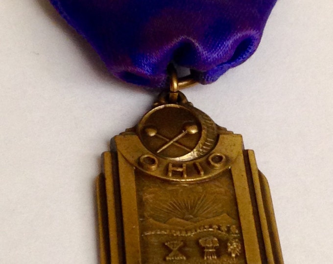 Storewide 25% Off SALE Vintage Bronze Tone Ohio's Music Educational Association Band Award Pin Featuring Purple Silk Style Banner Storewide 25% Off SALE Vintage Bronze Tone Ohio's Music Educational Association Band Award Pin Featuring Purple Silk Style Banner