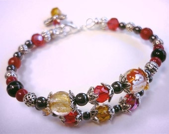 Red beaded bracelet with lampwork