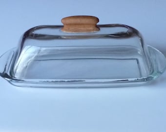 Butter dish with a hand carved wooden handle
