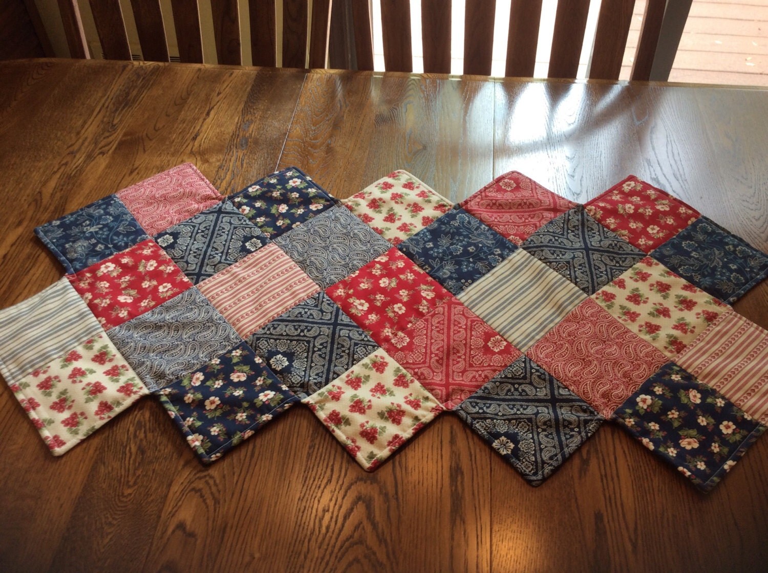 Patriotic quilted table runner zig zag shaped in red white
