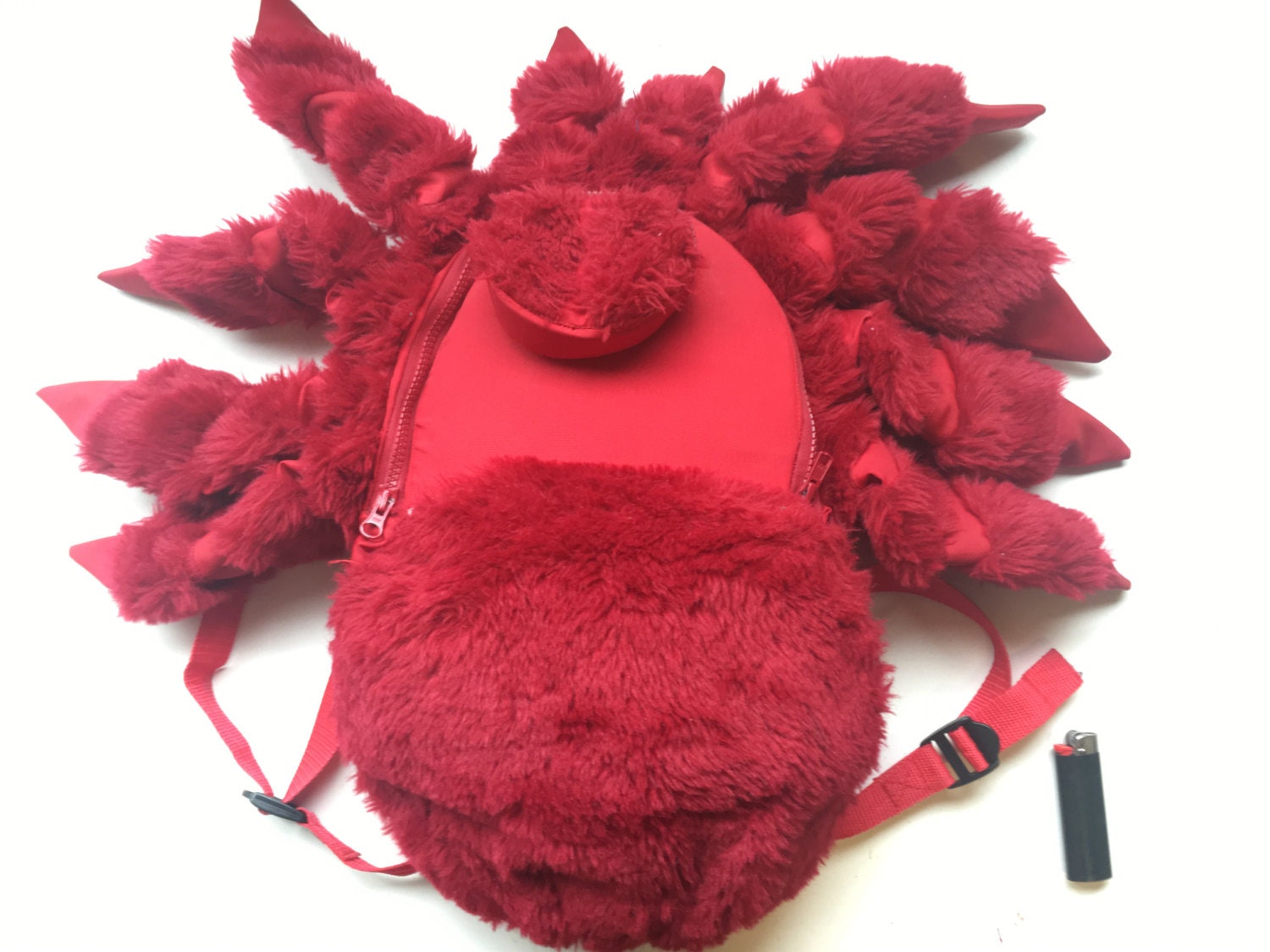 red and gray spider splash day bag