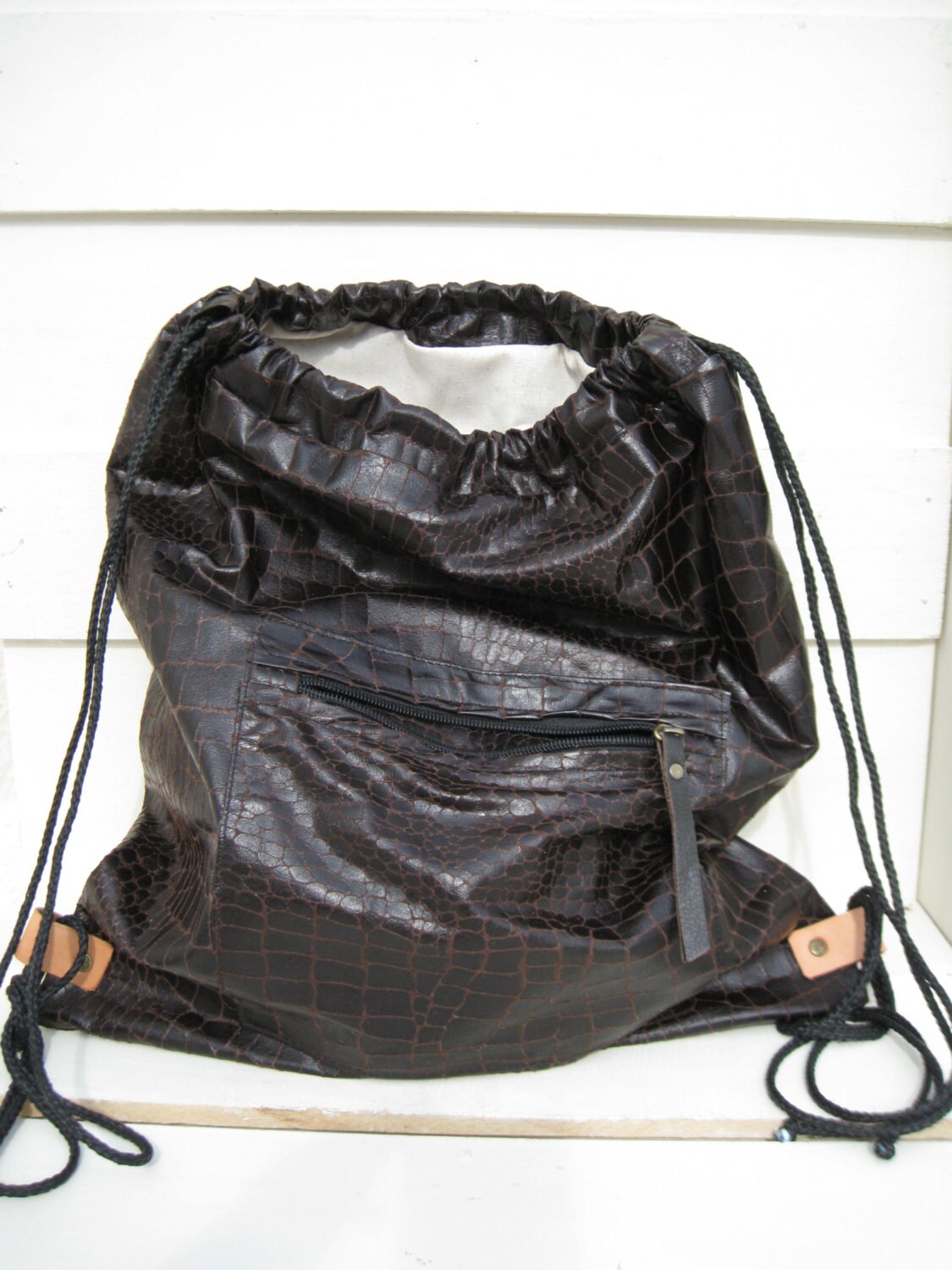 brown drawstring backpack