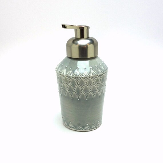 Grey glazed porcelain foam soap dispenser with stamped and