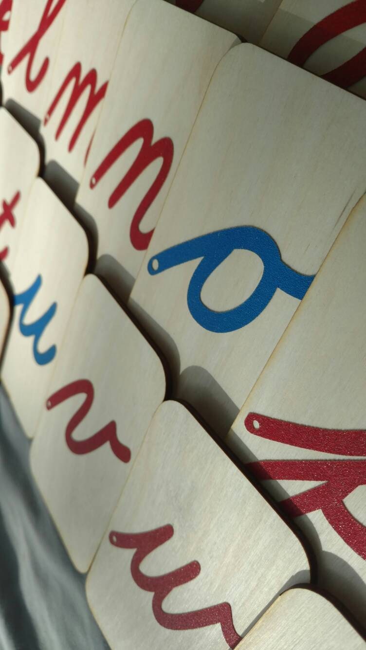 lowercase cursive sandpaper letters on 3x5 birch