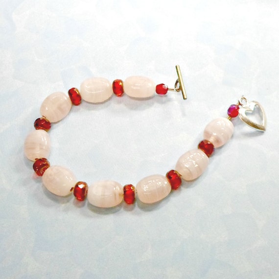 Items similar to Bracelet pink metallic red beads size 8 handmade by ...