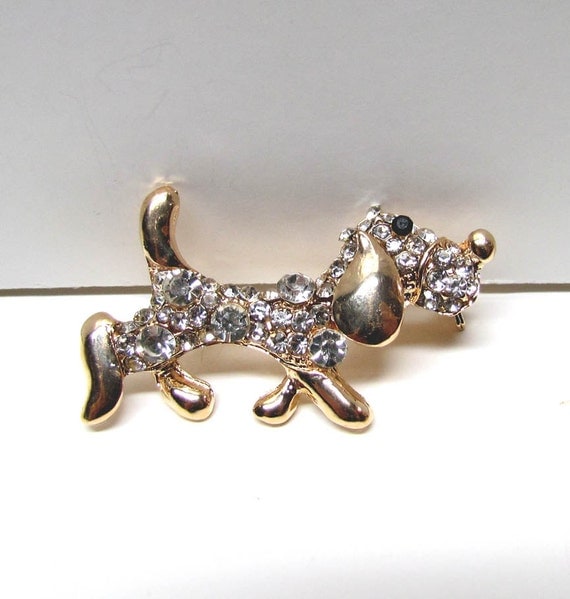 Items similar to Dog Pin Brooch, Gold Tone with clear rhinestones and