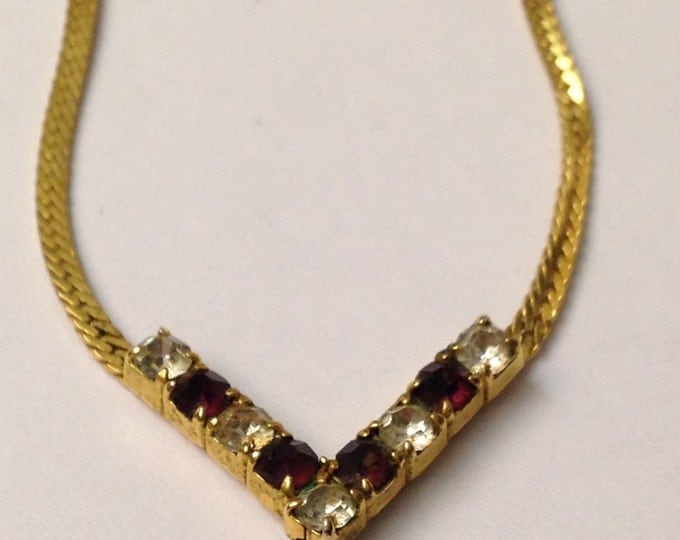 Storewide 25% Off SALE Vintage Gold Tone Herringbone Style Necklace With Diamond & Ruby Rhinestone V Shaped Pendant Featuring Elegant Design