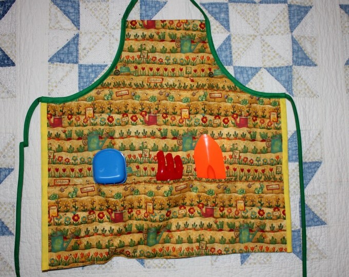 HALF PRICE ** Childs Gardening Apron. Yellow Orange Green Red Garden Print, with Deep Pockets. Gardening Tools and Gloves included.