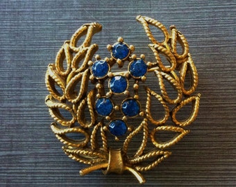 Vintage Lisner Gold Tone Laurel Wreath Brooch with Sapphire Blue Rhinestones
