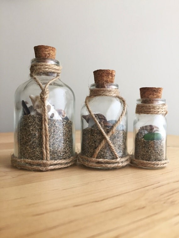in a bottle theme glass bottles seashells sand in a bottle theme glass bottles seashells sand
