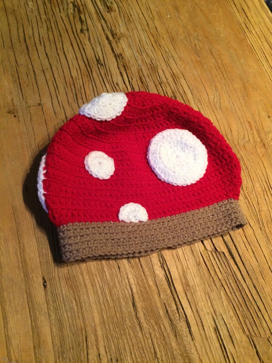 Toadstool childrens hat crocheted in soft wool. Classic red