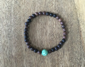 Items similar to Red/Green/Black beaded wooden bracelet on Etsy