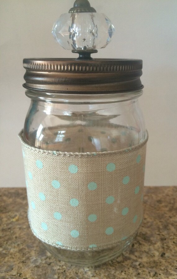 Small mason jar with ribbon and decorative knob lid