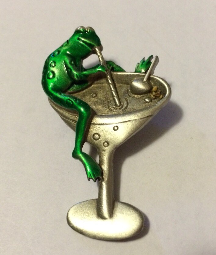 JJ Vintage Frog sitting on top of a martini glass sipping