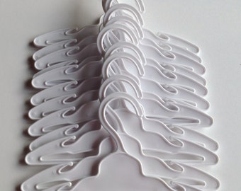 One dozen doll hangers for 18 inch doll clothes: Seven inch by four inch