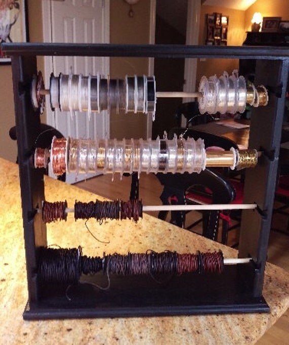 Jewelry wire spool organizer holds aprox 100 spools brushed