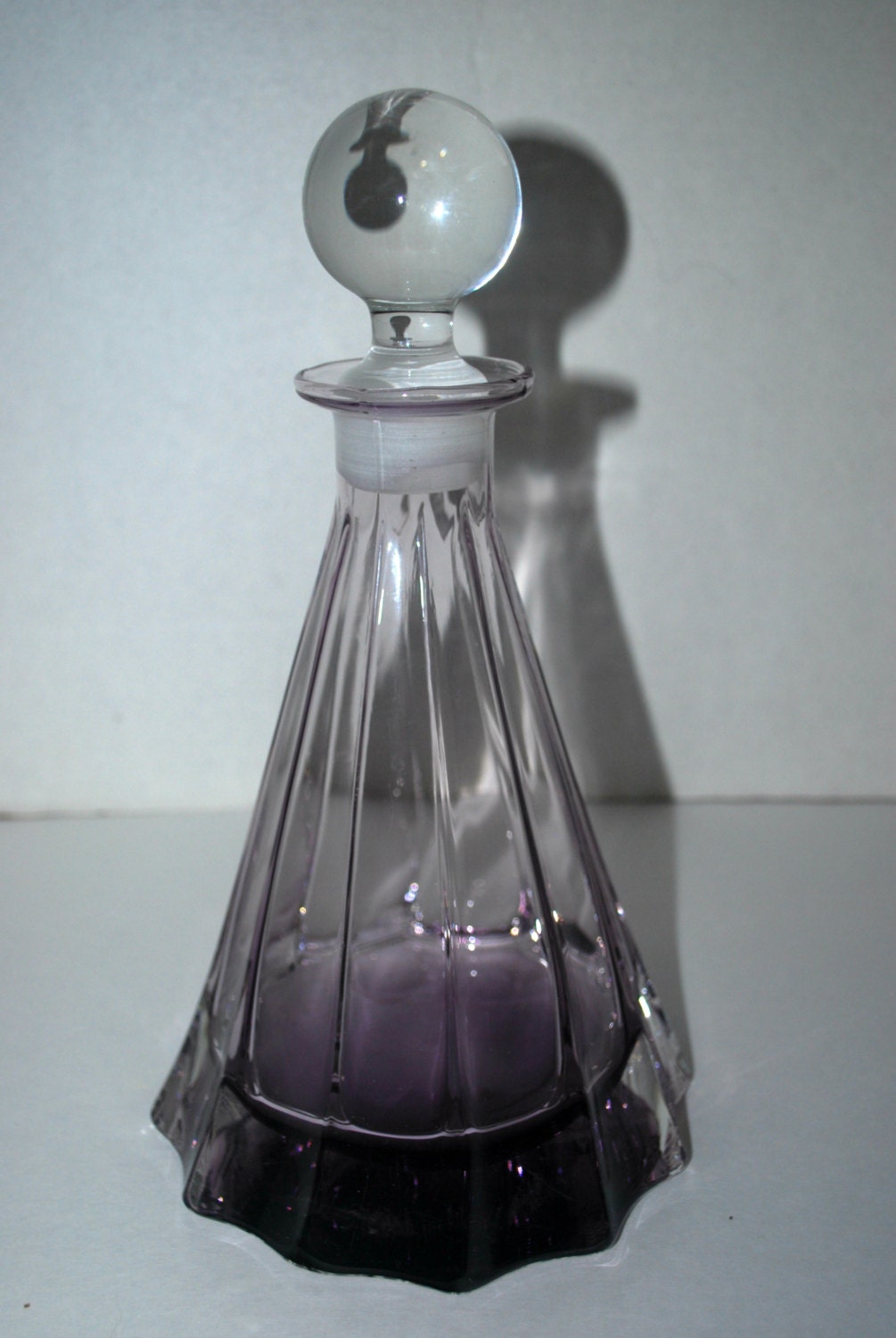 Purple glass decanter with clear round stopper vintage glass