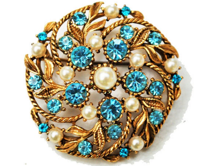 Blue Rhinestone and White Round Brooch Mid century gold floral Pin