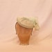 Handmade pale green ladies occasion hat, decorated with bow, delicate feathers & beading