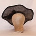 Stunning handmade gunmetal coloured contrast hat decorated with a large hot pink rose