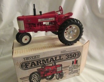 Farmall 350 toy tractor Ertl # 418 1:16 scale model red diecast metal, new in original box, vintage 1982