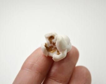 Popcorn pin, white porcelain, golden lacquer. Ceramic brooch. Pop corn. Food jewelry. Fun pin, realistic jewel. Contemporary jewelry