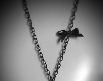 Vintage antique bronze necklace with mustache and bow