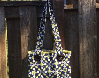 Tile Pattern Grommet Handbag