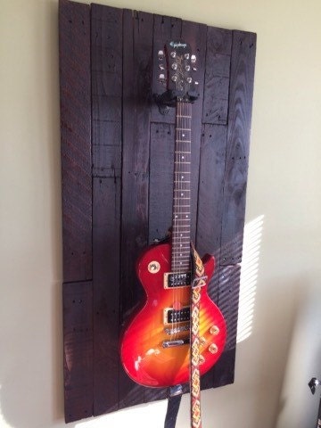 Guitar wall display rack made from up cycled wood