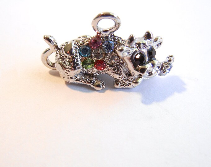 Small Silver-tone Rhinestone Accented Laying Bull with Flower Charm