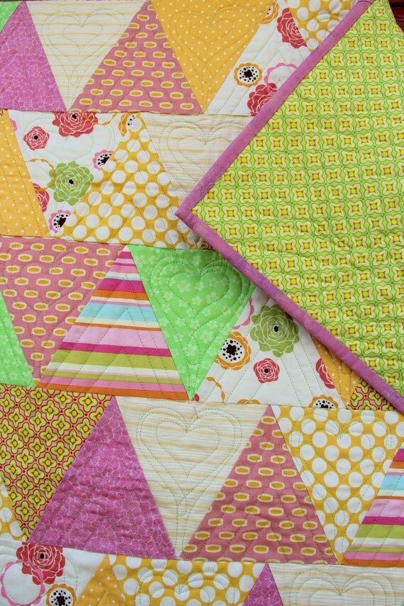 Quilts for sale sample baby quilt in fun colors. Triangle