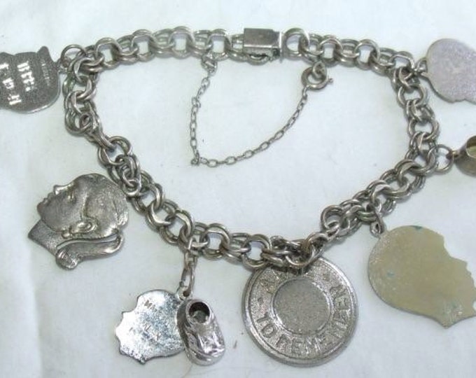 Storewide 25% Off SALE Vintage Sterling Silver Interlocking Baby Inspired Silhouette Charm Bracelet Featuring Eight Assorted Children Themed