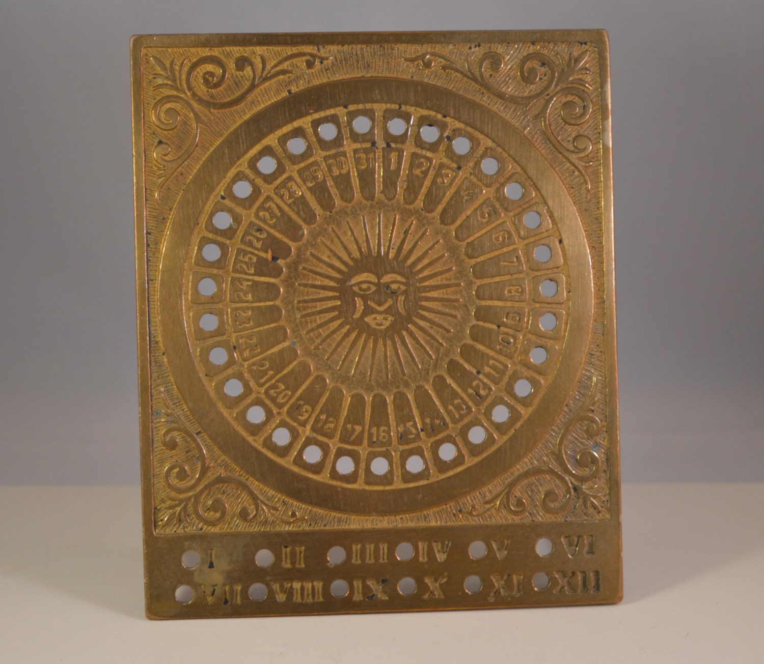 Vintage solid brass calendar