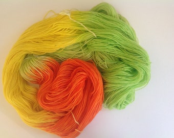 sock yarn , hand dyed sock yarn, Superwash wool and nylon blend . Orange , lemon and lime, citrus colors. Knitting yarn.
