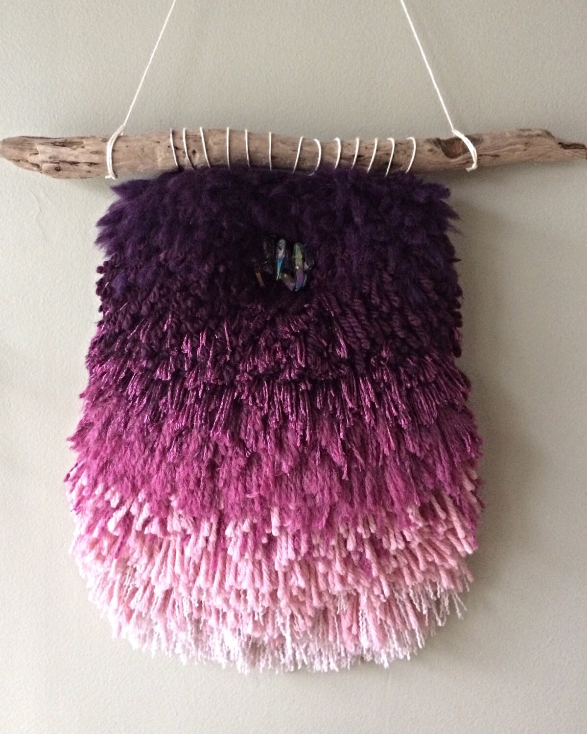 Plum ombré woven wall hanging with titanium quartz crystals