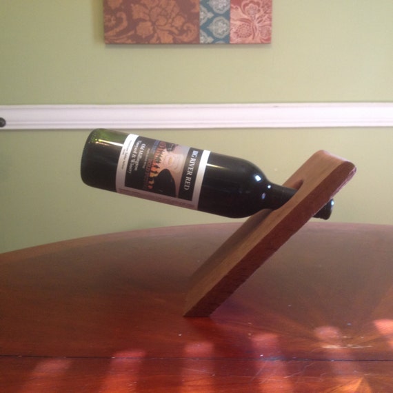 Gravity defying Wine Bottle Holder by Tailgatetoss on Etsy