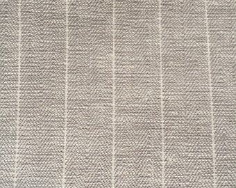 Cotton fabric has thin stripes.