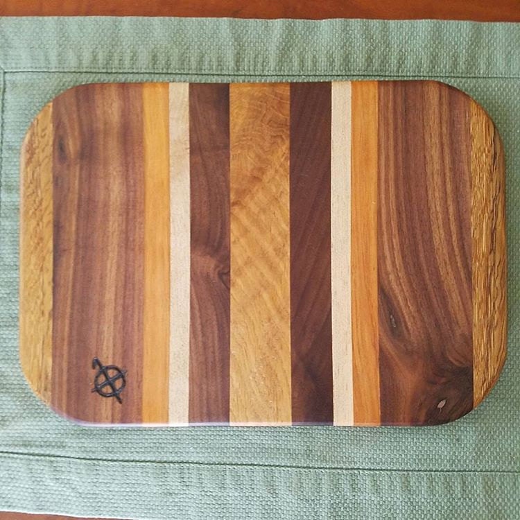 Oak walnut beech and maple cutting board. by CompassWoodworksCo