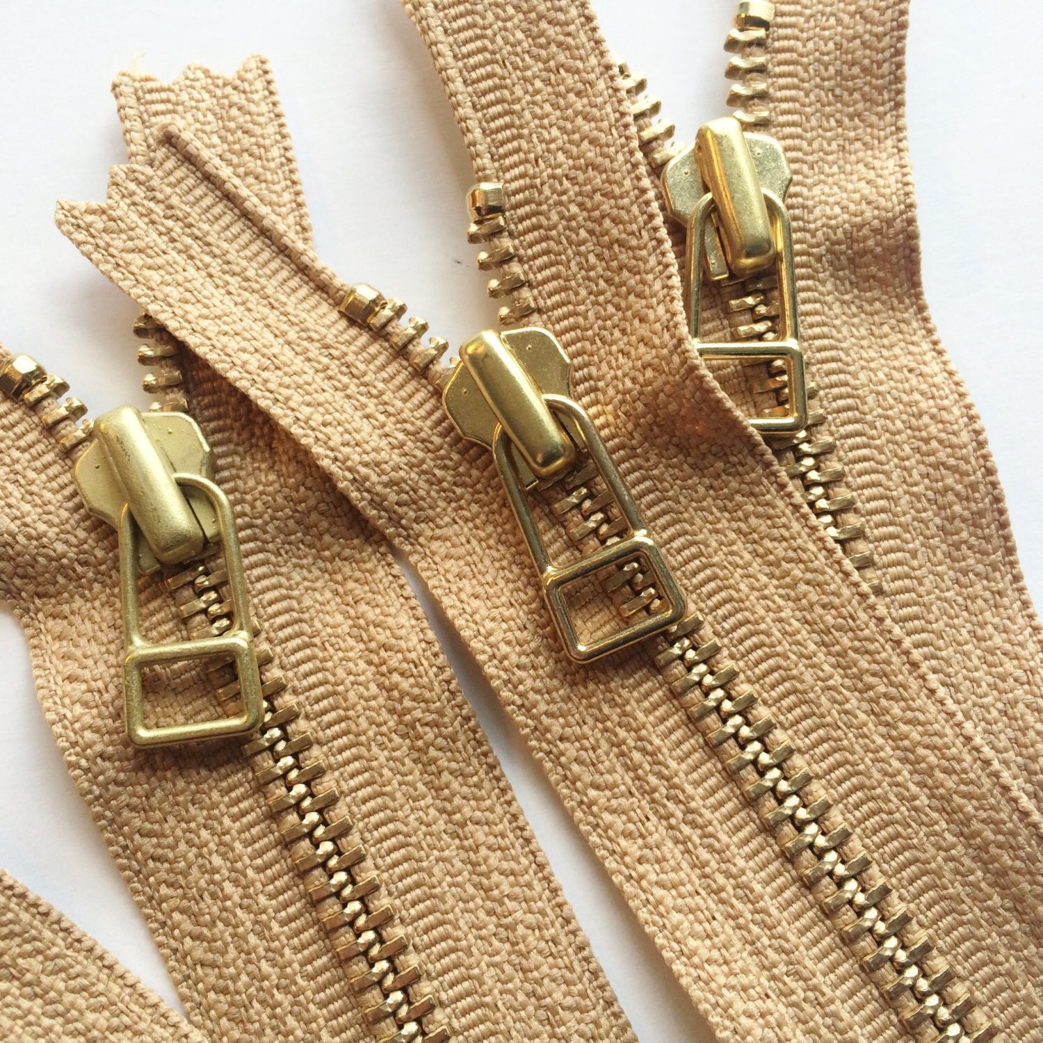 YKK metal zippers with gold brass teeth and DHR Wire style