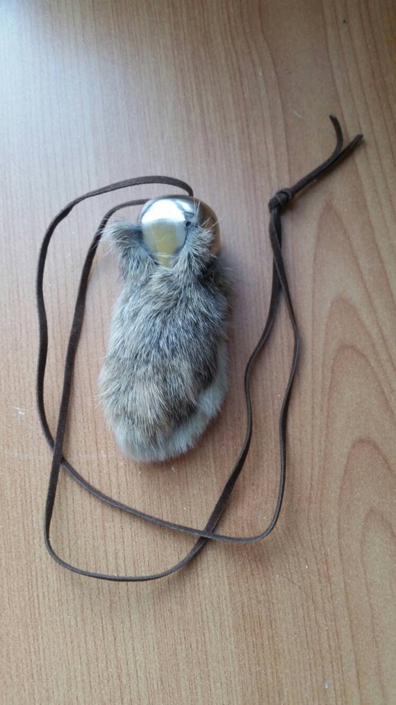 Lucky rabbits foot charm on natural cord