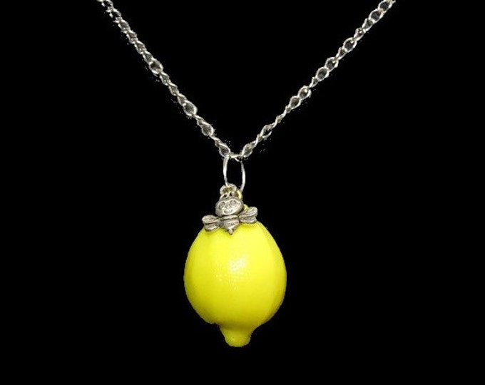 Lemon pendant, bright yellow lemon drop focal necklace with a small silver smiling bee attached, silver plated chain with dragonfly clasp