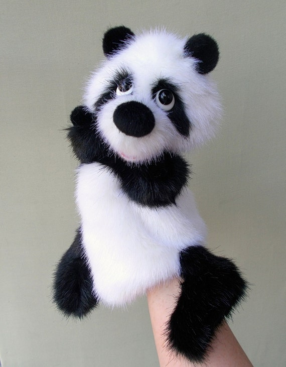 Panda. Big panda. Toy on hand. Puppet theatre. Bibabo. Toy